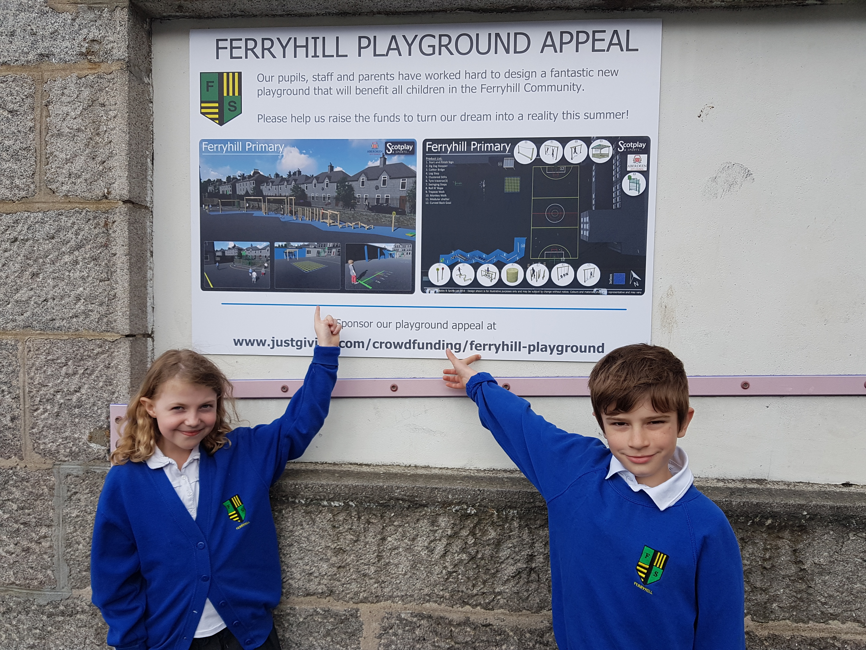 Primary four pupils Elizabeth Martin and Scott Condie look at the plans for the revamped playground at Ferryhill School.