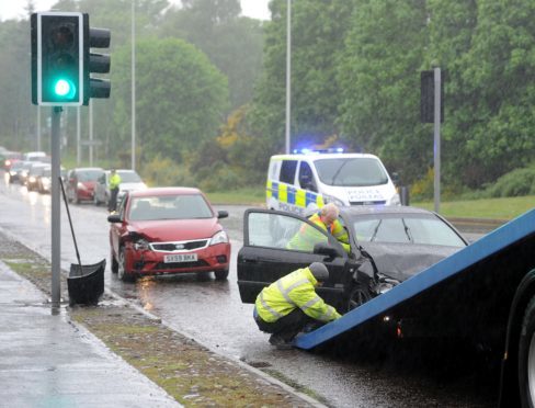 Emergency services were called to a two-car crash on Barn Church Road in the Culloden area of Inverness. Picture by Sandy McCook