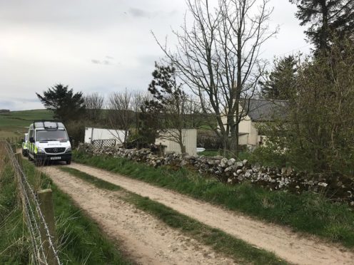 Police at the farmhouse.