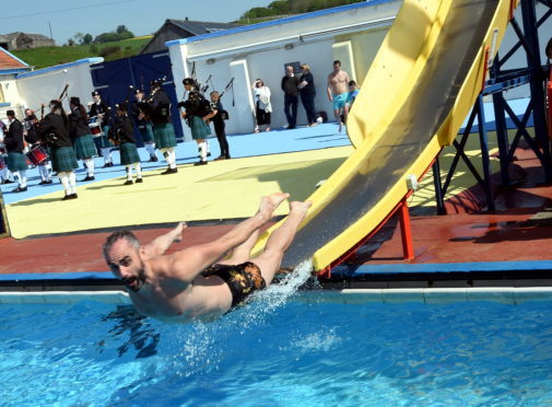 The opening day of the outdoor swimming pool at Stonehaven. In the picture is John Dickson having fun on the chute. 
Picture by Jim Irvine  26-5-18