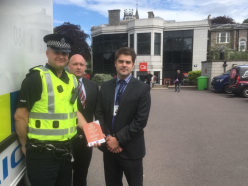 Sergeant Simon Lewis-Dalby, Detective Constable Mark Eddie and Grant Pinnell, from Aberdeen's fraud unit