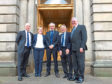 Rural Economy Secretary, Fergus Ewing, on the right, with the four agriculture champions. These are from left to right - Archie Gibson, Marion MacCormick, Henry Graham and John Kinnaird.