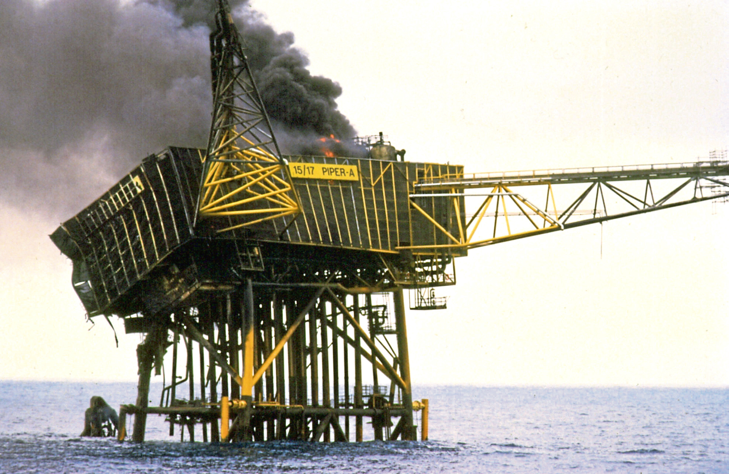 The remains of Piper Alpha smouldering on July 8 1988.