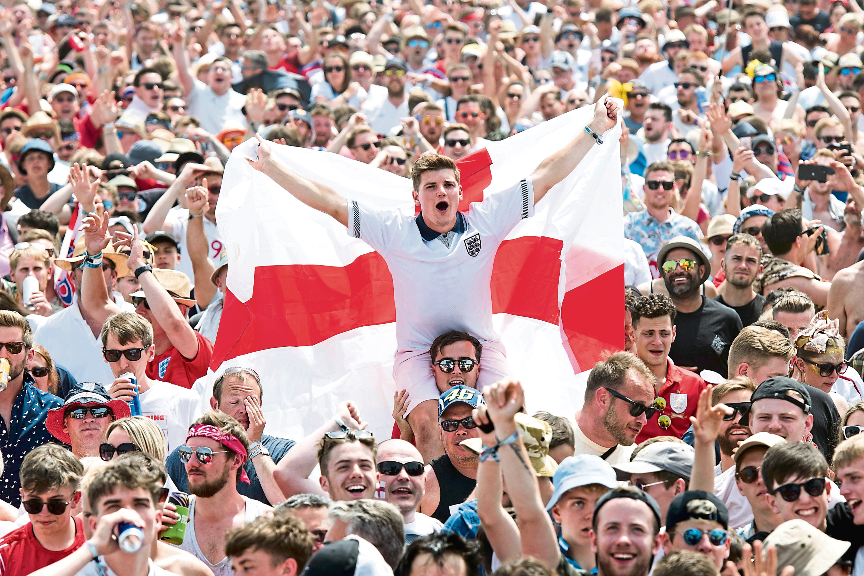 England supporters and festival goers watch England v Panama during the Isle of Wight festival at Seaclose Park, Newport