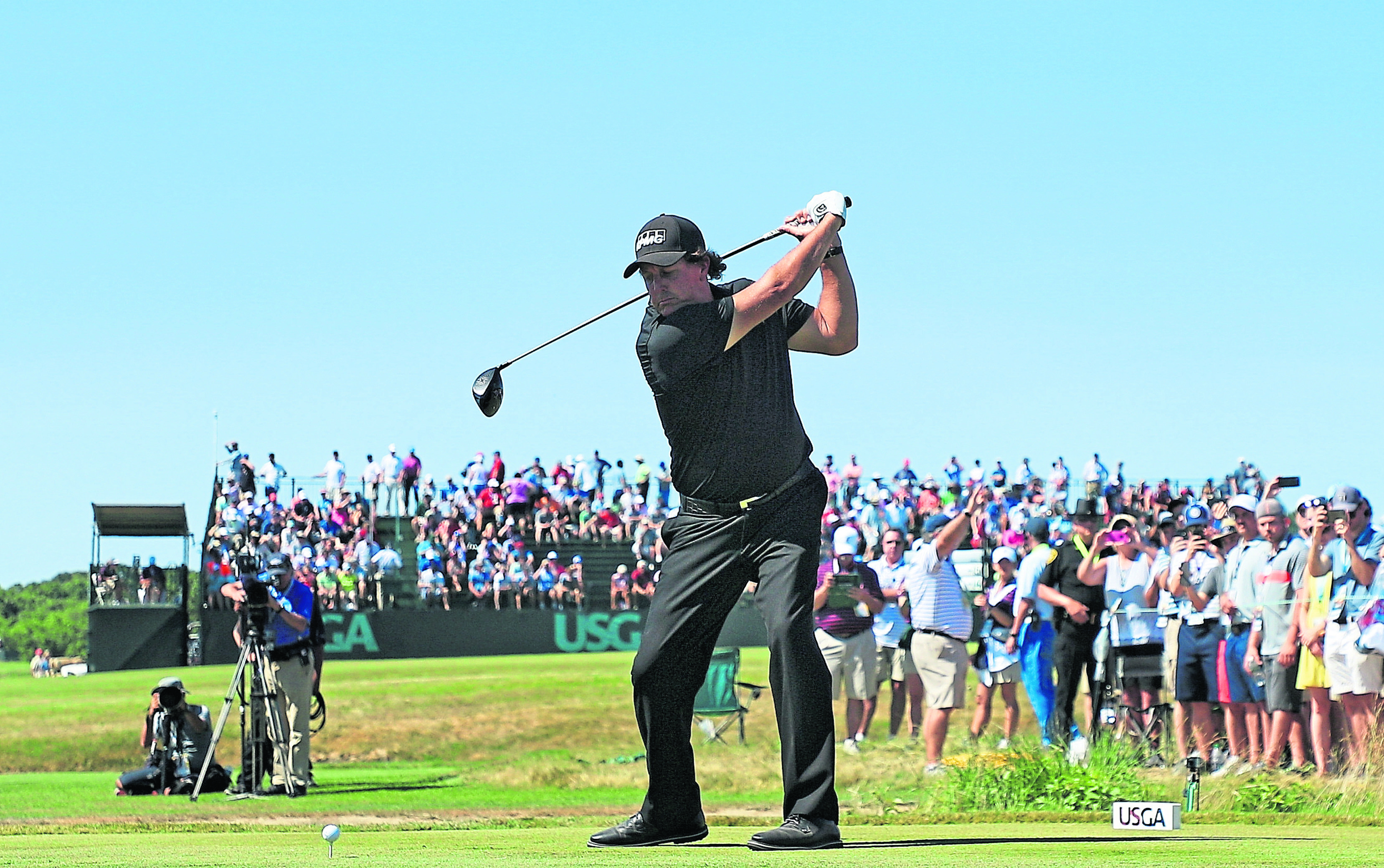 Phil Mickelson plays his shot from the eighth tee during the final round of this years US Open.