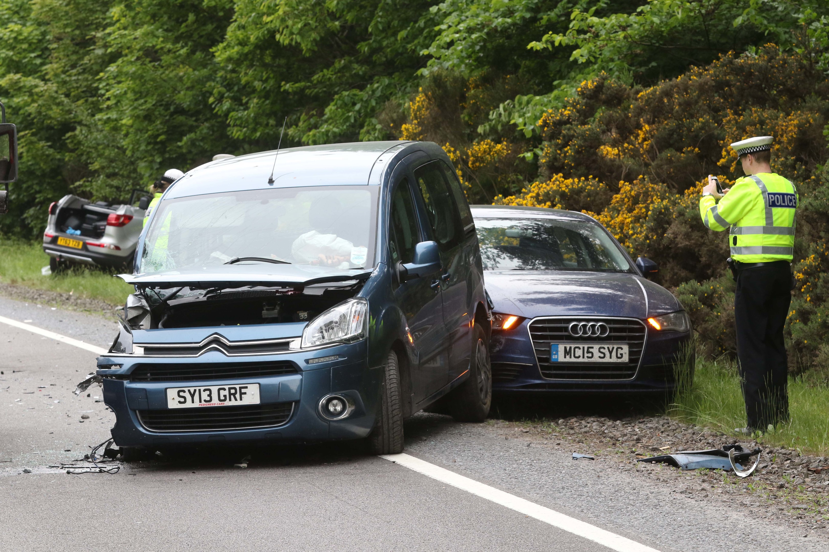 Scene of a three-vehicle crash on the A96 near Inverness Airport.