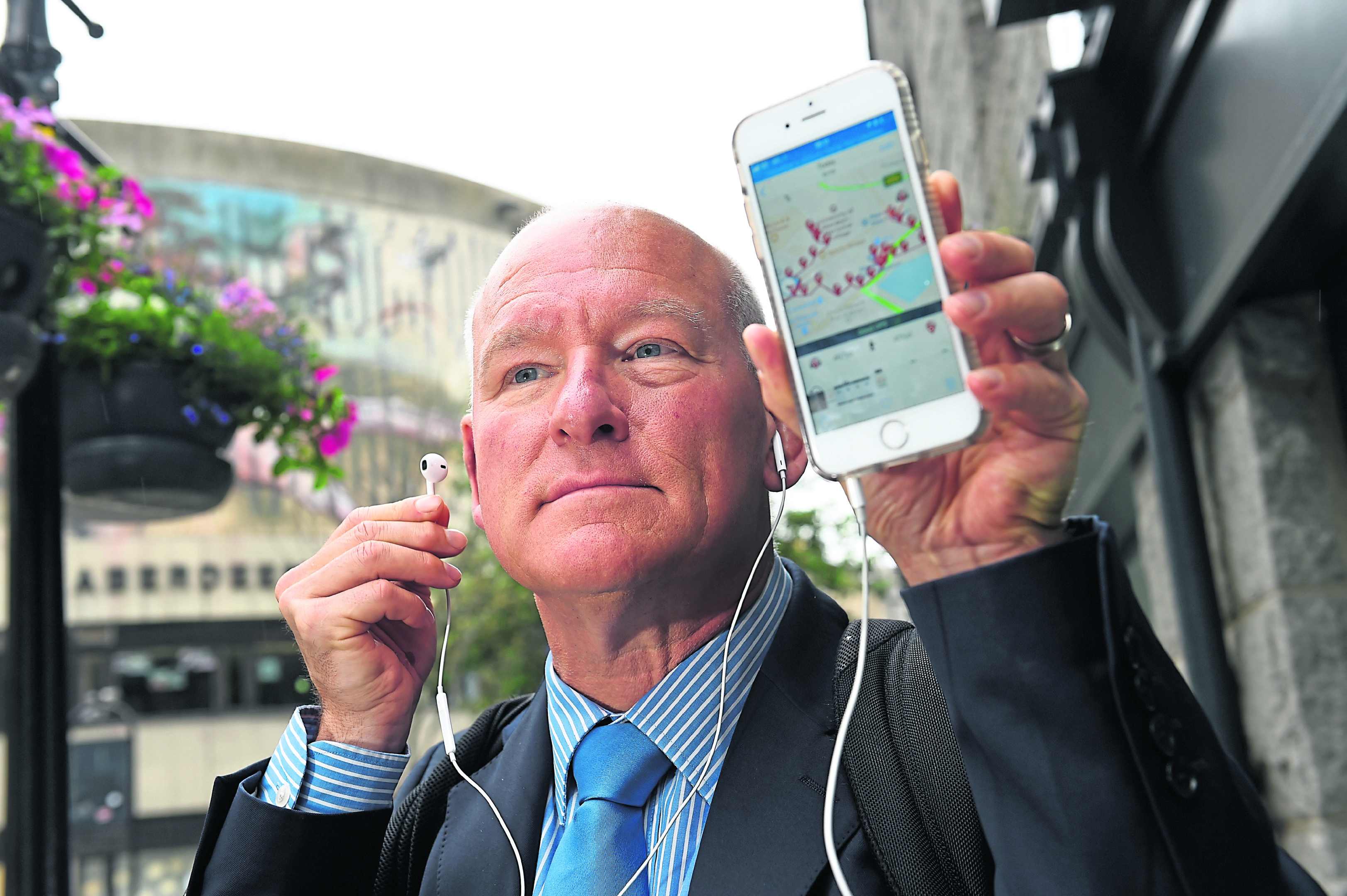 Bryan Atchison has launched a self-guided tour of the city, with phones using GPS to match a walkers location and play audio automatically.

Picture by Kenny Elrick.