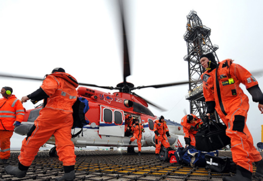 Offshore workers arrive on their platform by helicopter