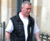 Kevin McLean leaving Dundee Sheriff Court