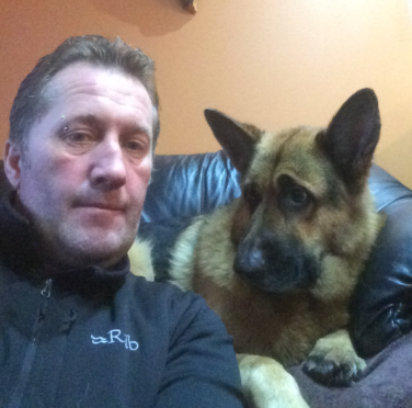 Colin Maclean with Zak the Alsatian, who suffered a heart attack on Tuesday