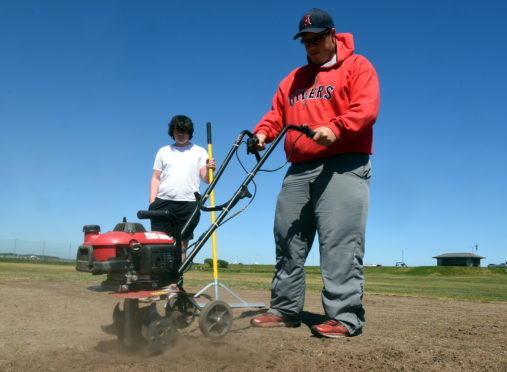 Aberdeen Baseball Club players Connor Smith and Stephen Evans working on their permanent home beside Linx Ice Arena, Aberdeen.