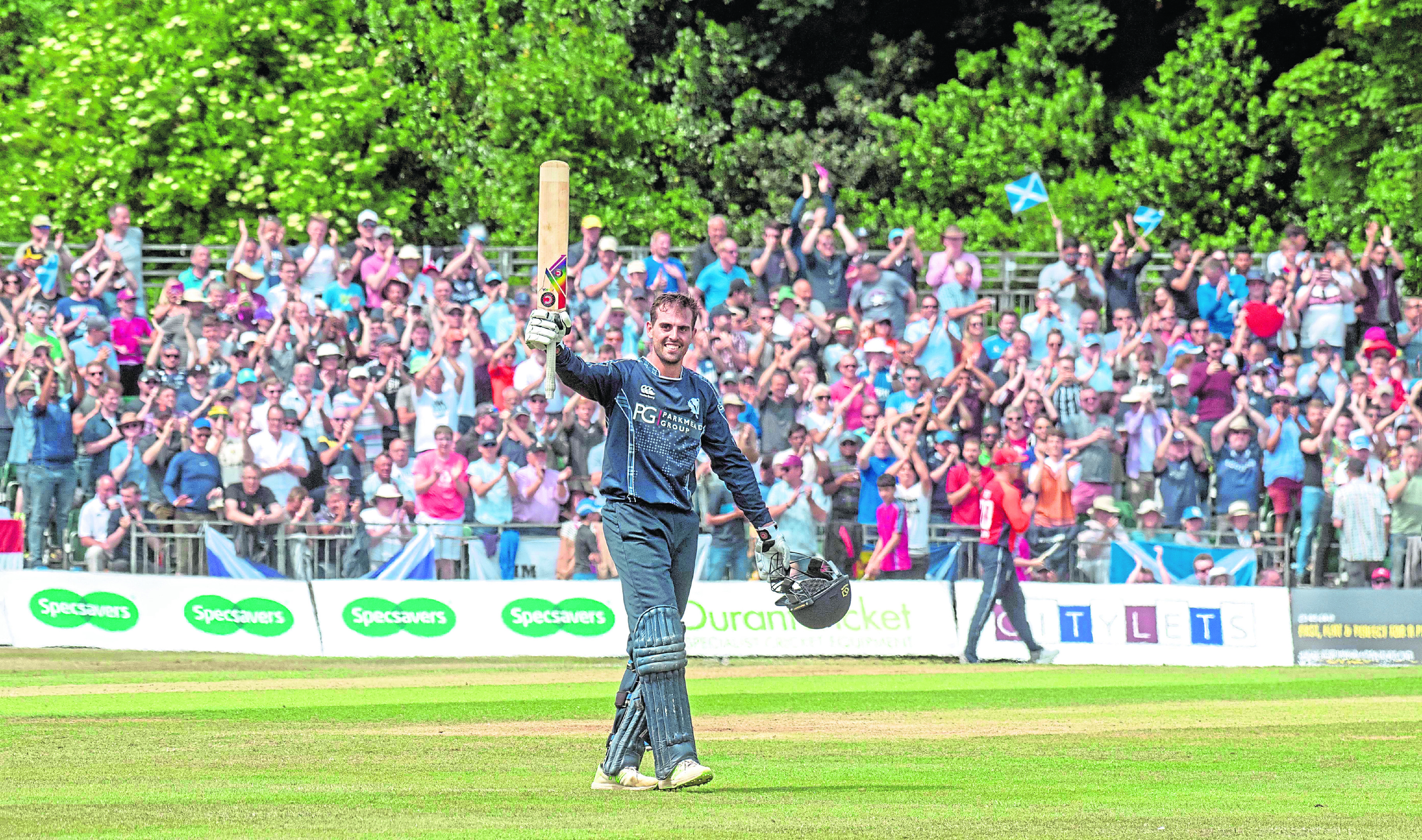 Calum MacLeod celebrates his century against England to help Scotland to a famous one-day international victory at the Grange, Edinburgh.