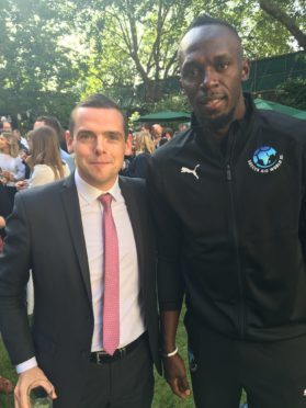 MP Douglas Ross with Usain Bolt