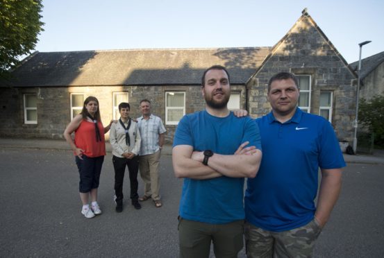 Fraser McGill, chairman of the Dufftown and District Community Association, pictured left, and Steven Dalgarno, chairman of Dufftown Community Centre, pictured right, are preparing to sign a lease for the community centre. Also pictured: Vicky Allan, secretary of Dufftown Community Centre, Stacey Hewkin, Beaver Leader,
George Tulloch treasurer of the Dufftown and District Community Association.