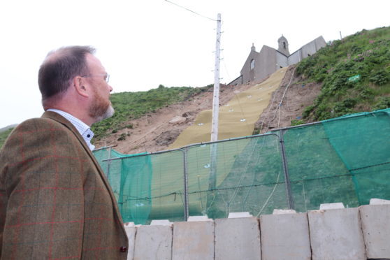 David Duguid MP at the temporary landslip repair at Gardenstown