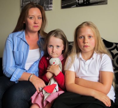 Janet Alexander with her daughters Rose and Lois.