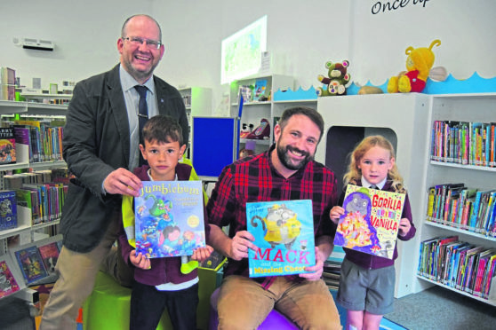 L-R Councillor Mark Findlater, Jakub Jankowicz pupil from Banff primary, author Chae Strathie and Cadi-Li Wood pupil from Banff Primary