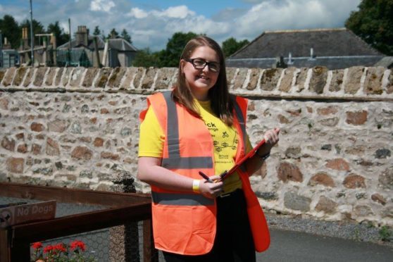 One of last years' Methlick Cycle Challenge marshals wearing the official high-vis jacket.