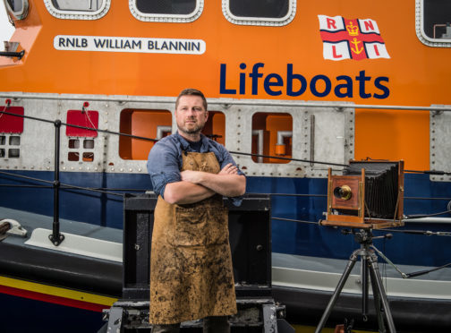 Wet Plate photographer Jack Lowe from the Lifeboat Station Project at Buckie Lifeboat station.