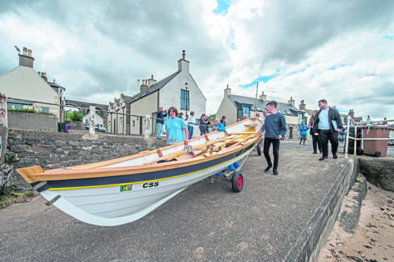 Cullen Sea School launch new skiff that has been built by Buckie High School students in a ceremony at Cullen Harbour last year.