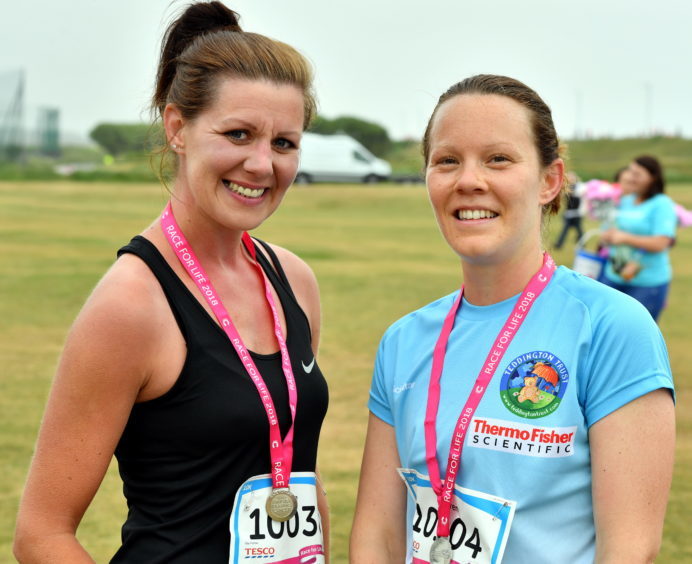 Race for Life ; 
At Aberdeen beach in aid of Cancer Research UK.     
Pictured -  Eve Ferguson (left) and Lauren Anderson, who were first to finish the 10k.     
Picture by Kami Thomson    10-06-18