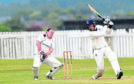 Stoneywood wicket keeper Martin Reid with Falkland batsman Cameron Nellies.