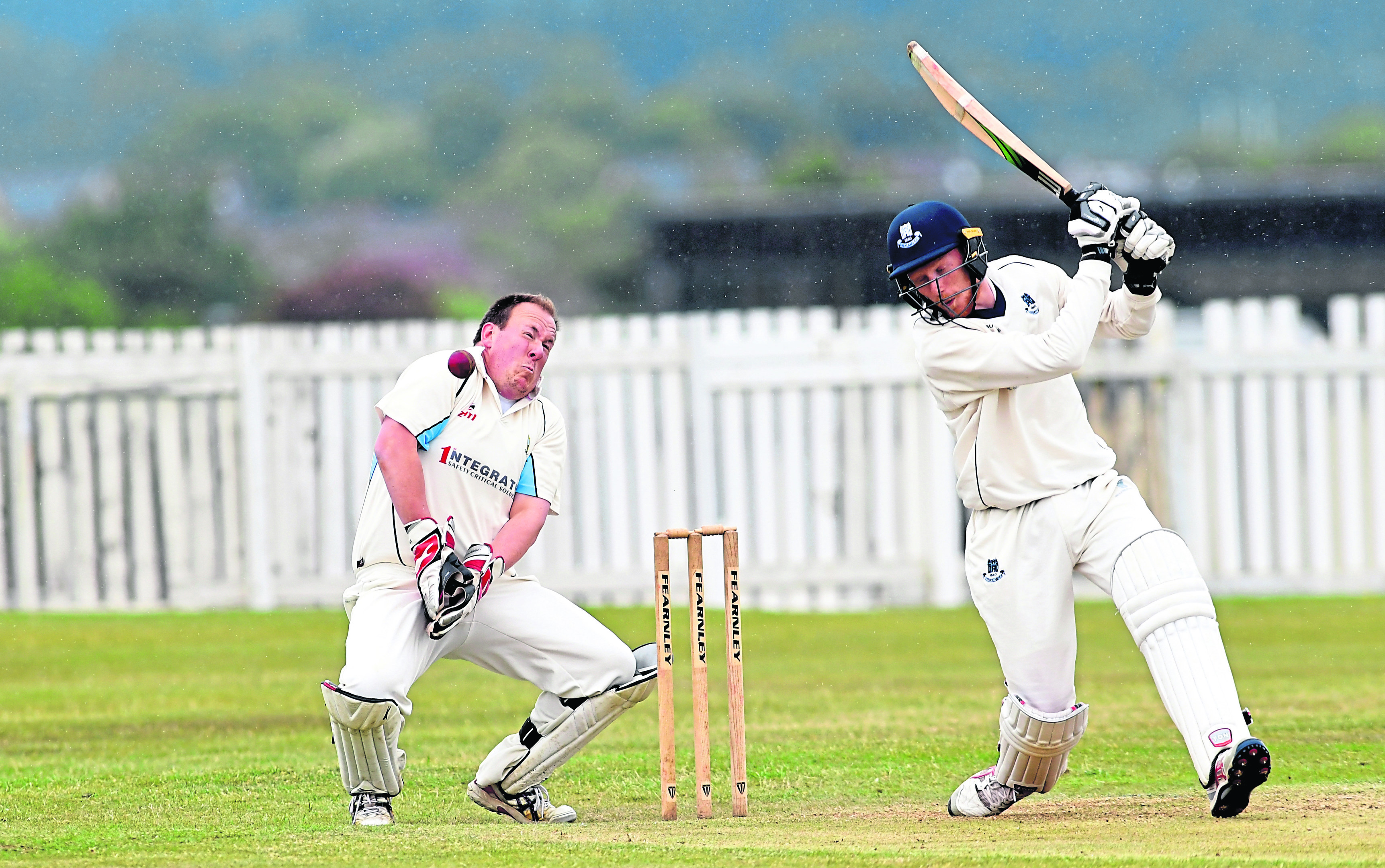 Stoneywood wicket keeper Martin Reid with Falkland batsman Cameron Nellies.