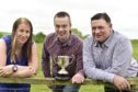 Antiques dealer Robert Cook (centre) with New Deer Show president Alistair Kindness and secretary Lynne Morrison and the Parkhouse Cup,  80 years after it vanished.