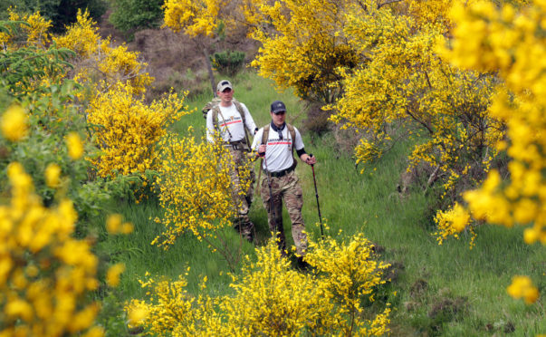 People take part in the annual Cateran Yomp as 893 soldiers and civilians walk together on a 24-hour trek across the Cateran Trail in Perthshire, finishing in the early hours of Sunday to raise money for ABF The Soldiers Charity.