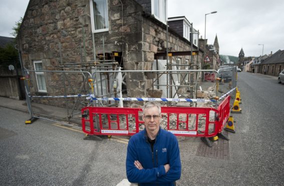 Philip Murray outside his parents' house in Rothes.