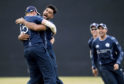 Scotland's Safyaan Sharif celebrates as Scotland win by six runs at The Grange in Edinburgh