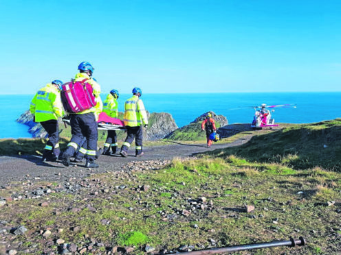 Coastguards abseiled down to reach the 87-year-old man.