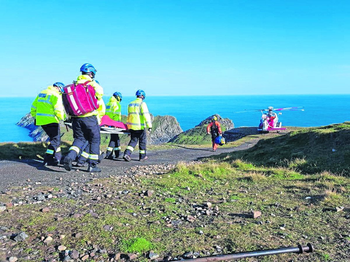 Coastguards abseiled down to reach the 87-year-old man.