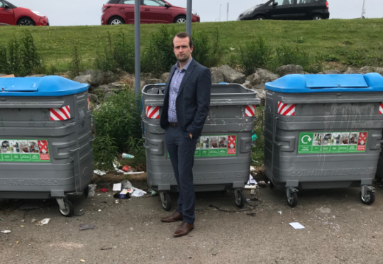 SNP councillor Stephen Flynn standing at the "disgusting" recycling point in Cove