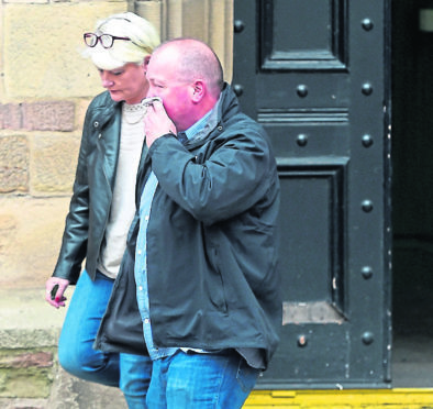 Paul Husbands accompanied by his wife leaves Tain Sheriff Court yesterday afternoon.
