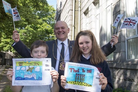 Lord Provost Barney Crockett with Armed Forces Day flag competition winner Maya Maclean and runner-up Matthew Marr.
