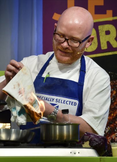 Former Masterchef winner Gary Maclean burns a towel.