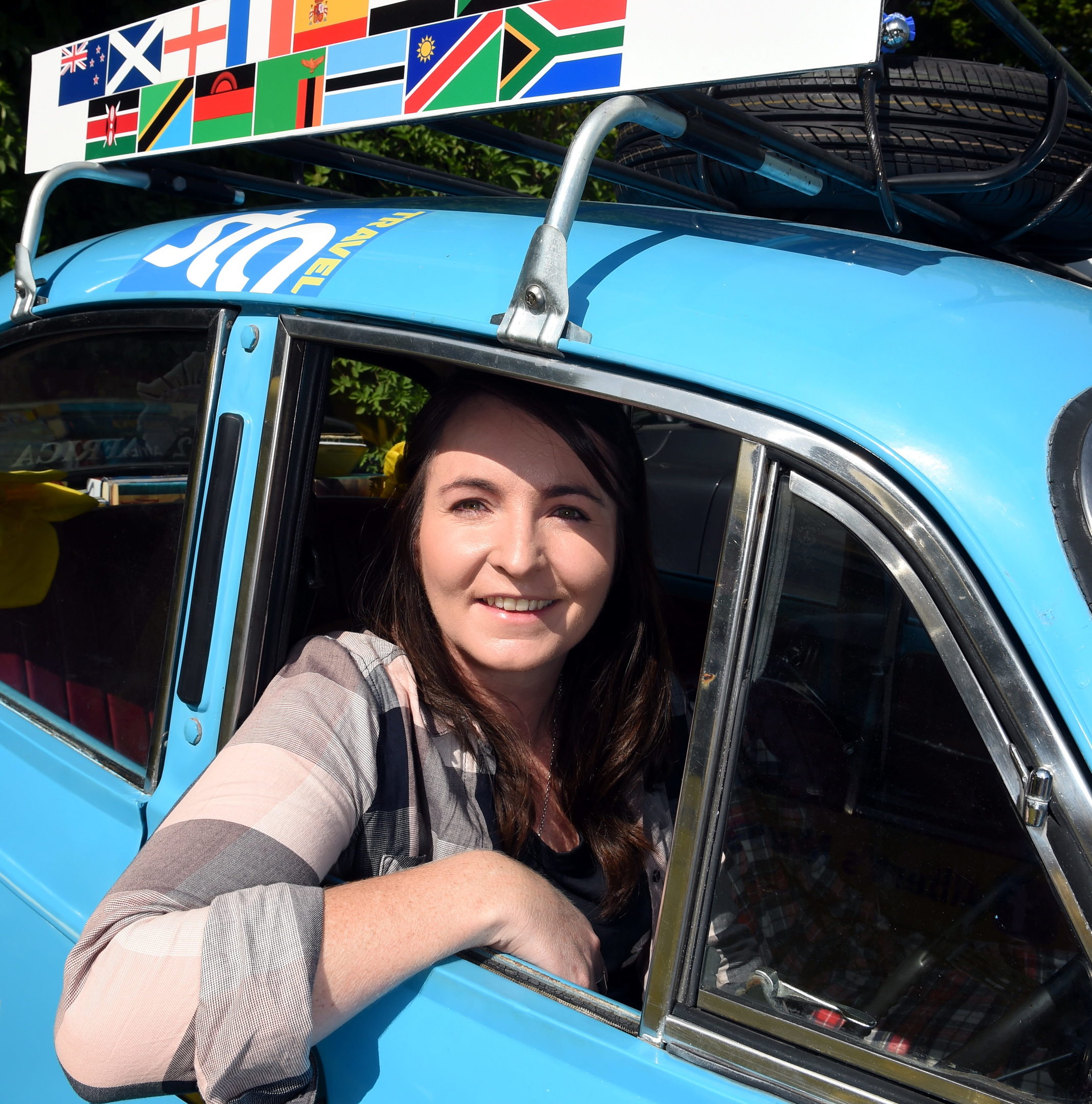 Laura Morrison, driving in her 1958 Morris Minor from Aberdeen to South Africa to raise money for cancer research.