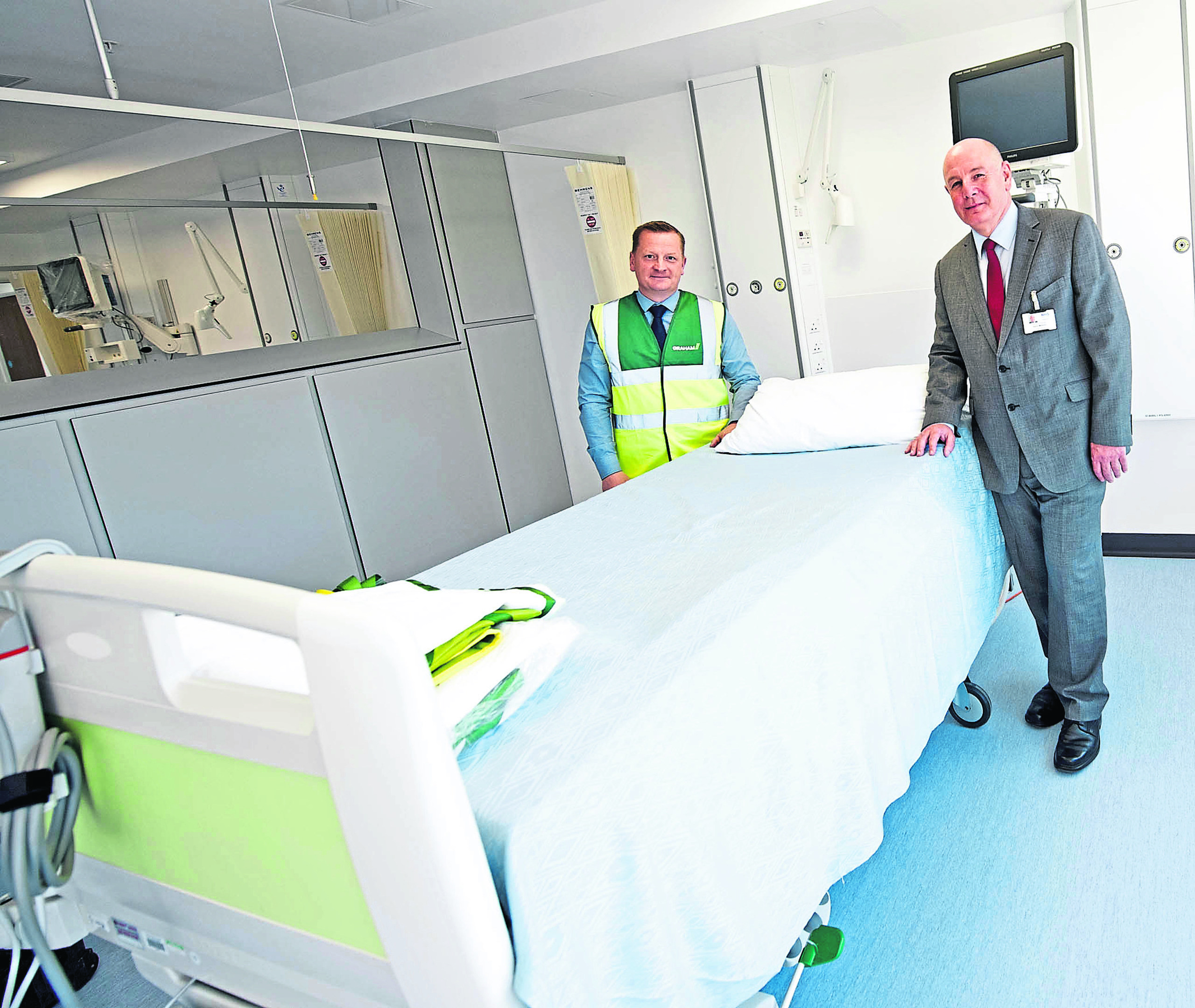 Kevin Minnock, Project Director NHS (right) with Pat O'Hare, contract director of Grahams, at one of the rooms at the new development at Raigmore.