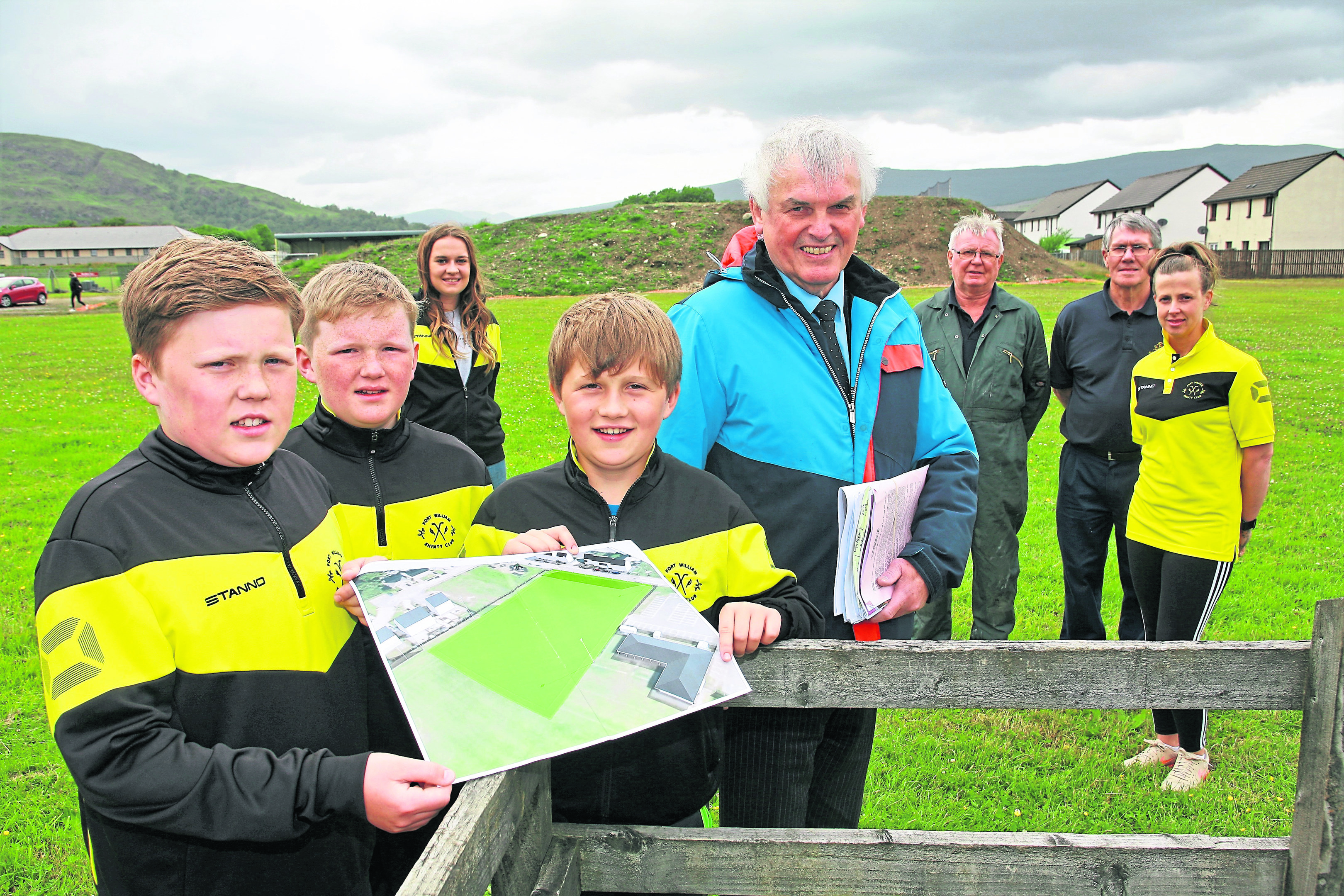 Brothers look over the plans for the new pitch at Fort William