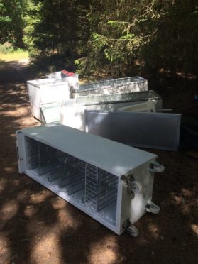 Fridges and freezers dumped to the road side.