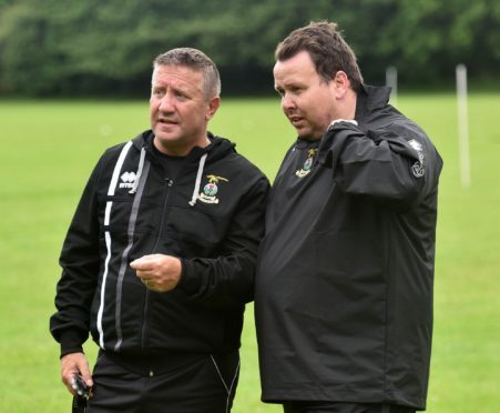 Scott Kellacher (right) with Caley Thistle manager John Robertson.