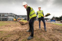 Alan Kennedy and Diageo International supply centre director Ewan Andrew break ground at the site in Menstrie