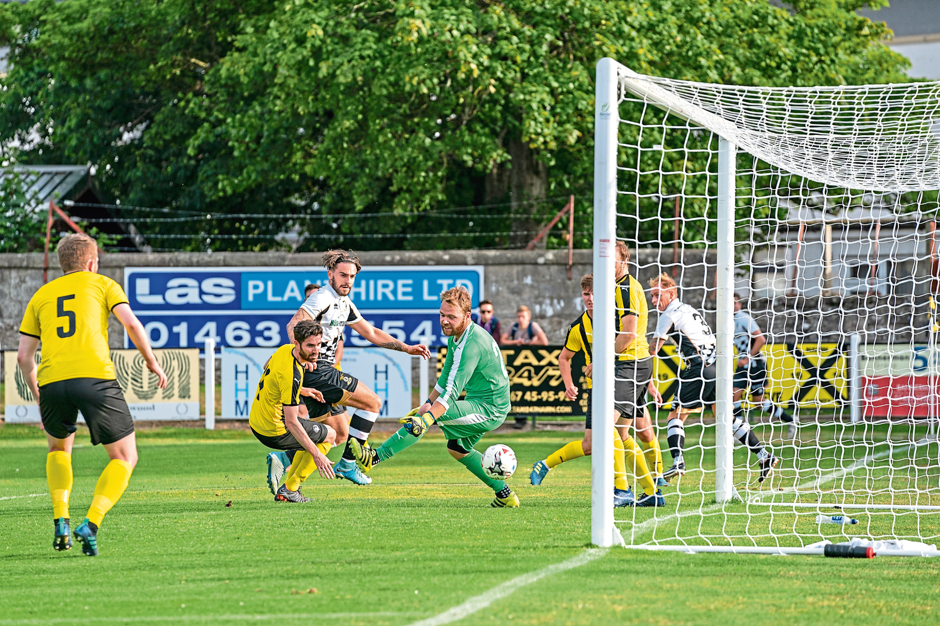 This is a photograph from the pre-season friendly Nairn V Inverness CT on Friday 6 July 2018 at Nairn County FC, Nairn. PICTURE CONTENT:-  Georhe Oakley no 10 ICT scores