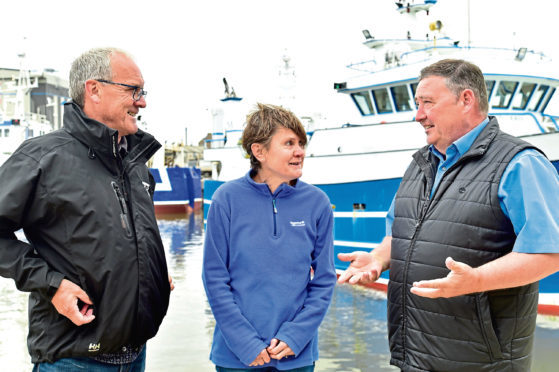 SWFPA policy advisor Kenny Coull, Bernadette Clark of the Marine Conservation Society and Scottish Seafood Association CEA Jimmy Buchan in conversation at Peterhead harbour.
