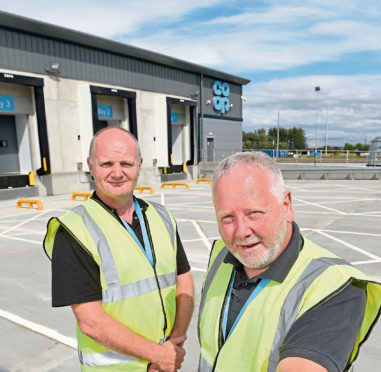 Tony Lewis (left) and Graham Kinghorn photographed outside the new Coop distribution centre at Dalcross, Inverness which is due to open in September,