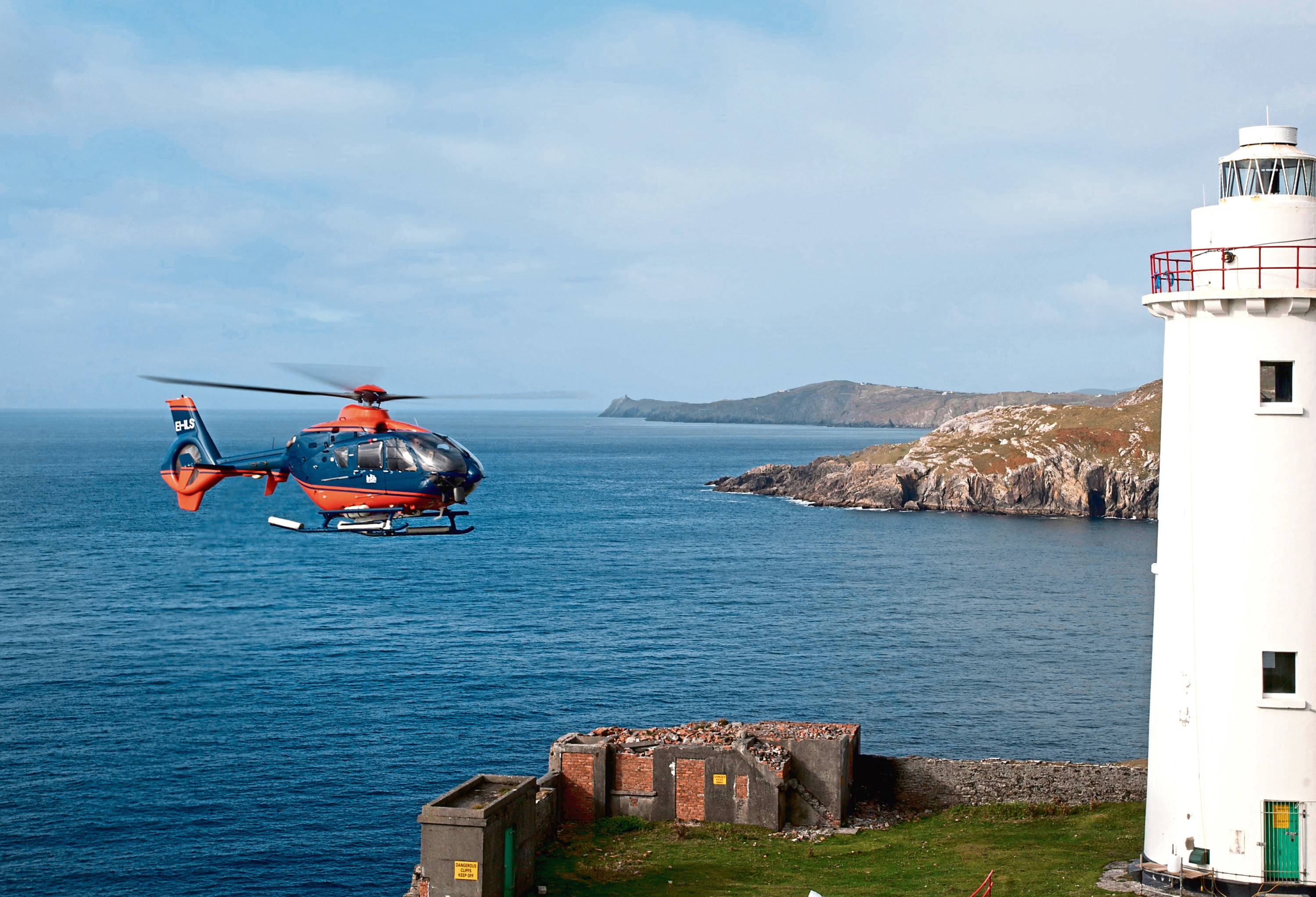 PDG Helicopters (subsidiary Irish Helicopters) EC 135 Helicopter carrying out mobilisation of materials at Ardnakinna Lighthouse (County Cork) in preparation for planned lighthouse maintenance. Ardnakinna Lighthouse is owned and operated by the Commissioners of Irish Lights.