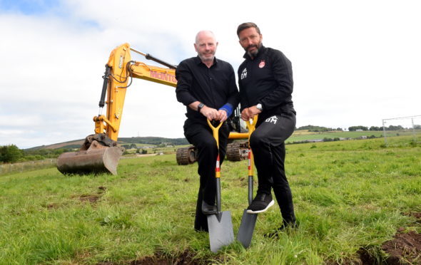 Stewart Milne and Derek McInnes broke ground on the training complex at Kingsford yesterday.