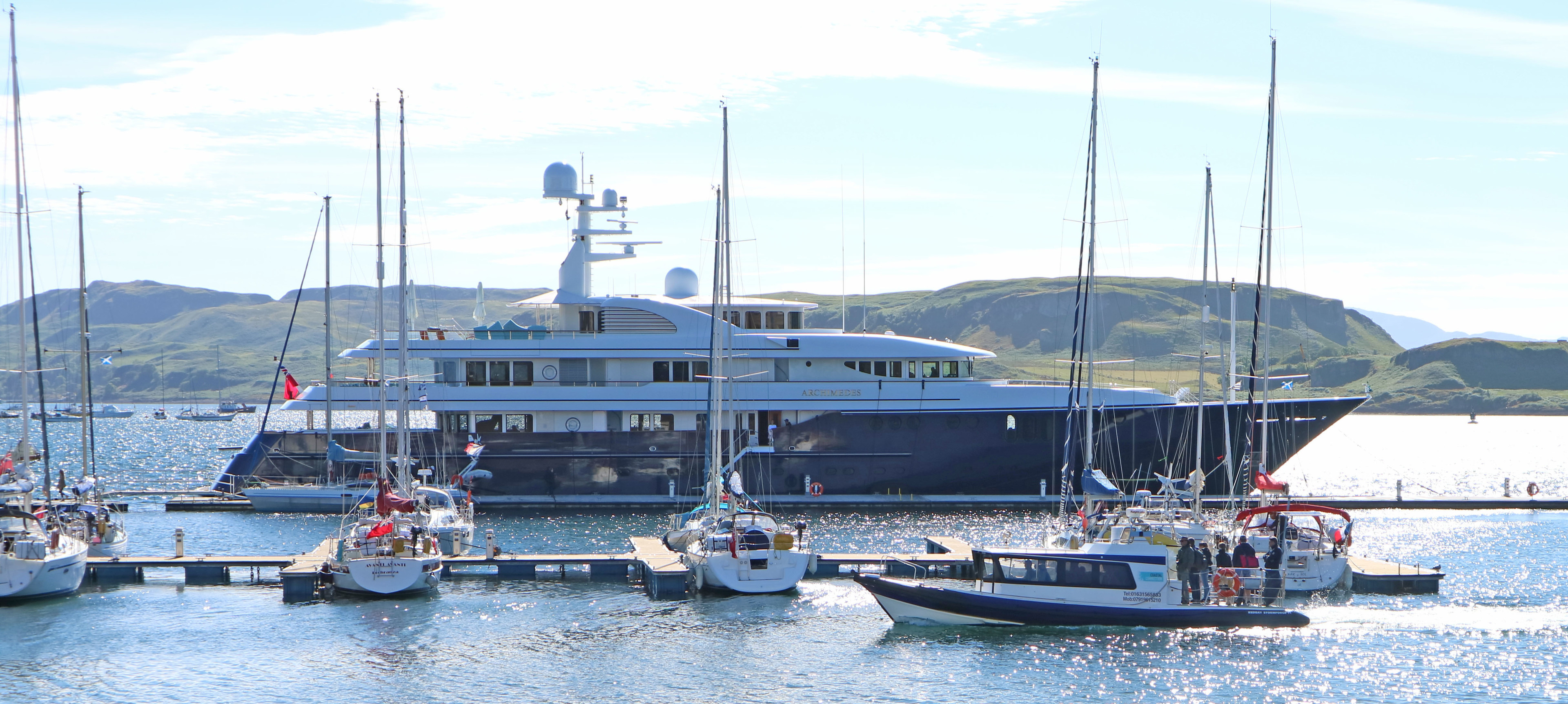 86M Long super yacht Archimedes lies against the breakwater Oban bay.