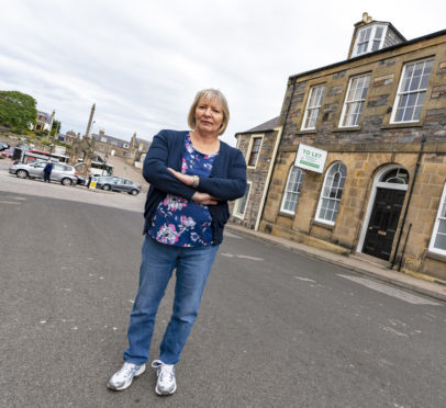 This is Clr Theresa Coull of Keith and Cullen Ditrict outside the now closed Bank of Scotland in Grant Street, Cullen, Moray on Monday 9 July 2018. They are to start a new campaign to bring an ATM to the town. Photographed by Brian Smith T/A Jasperimage. ©